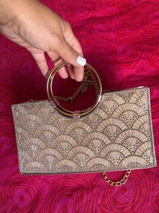 Bolso de fiesta dorado con pedrería
