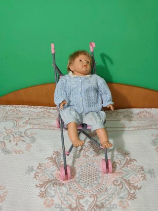 Muñeca Bebe con carrito de paseo