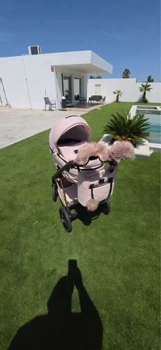 Cochecito bebé rosa de la marca toral como nuevo ,