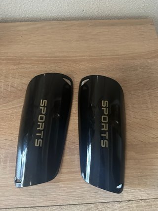 Espinilleras deportivas negras