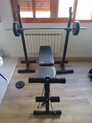 Banco de pesas y discos gimnasio