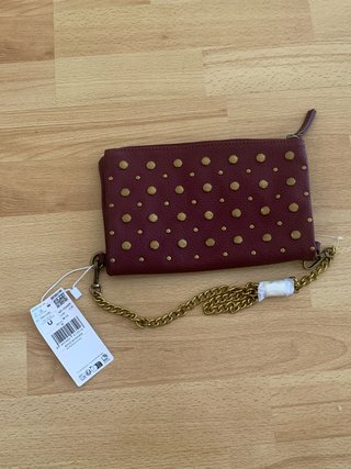 Bolso de mano con tachuelas