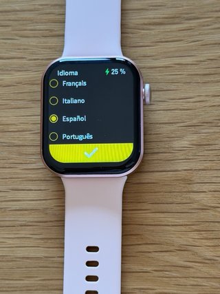 Smartwatch rosa con cargador y manual