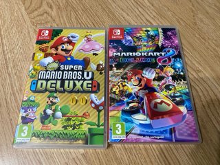 Nintendo Switch Azul Neón/Rojo y dos juegos