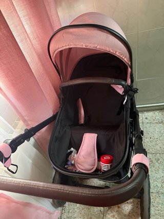 Cochecito niña rosa casi nuevo