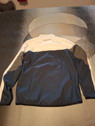 Chaqueta deportiva Head azul y blanca