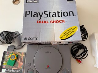PlayStation Dual Shock Gris + Tarzán