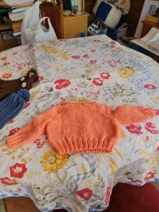 Conjunto bebé: Chaqueta y mono naranja