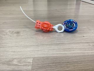 Beyblade con lanzador de cremallera