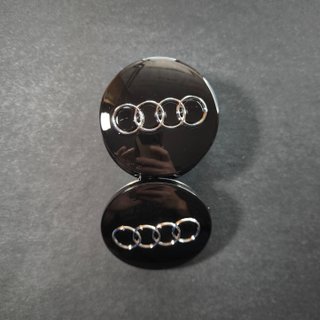 TAPABUJES AUDI 60mm NEGRO - EMBLEMA LLANTAS AUDI