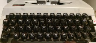Máquina de escribir portátil Olympia y Brother