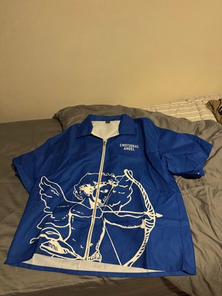 Sobrecamisa azul con estampado de ángel