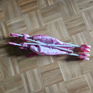 Sillita de paseo para muñecas rosa
