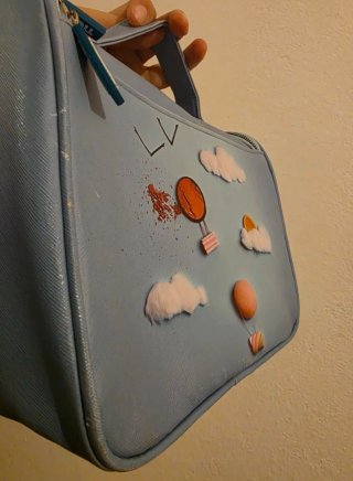 Beauty case Tigotà azzurro con decorazioni