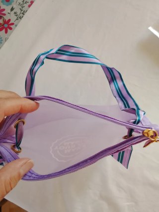 Pochette trasparente con zip e tracolla