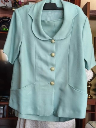 Traje chaqueta verde mujer