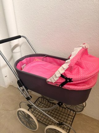 Cochecito de muñecas rosa lunares