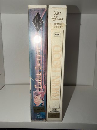 2 VHS Disney: La Bella Durmiente y Robin Hood