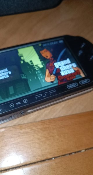 PSP 1004 + Caricabatterie + Custodia + Scheda