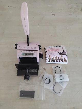 Perforadora Zutter con manual y accesorios