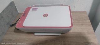 Impresora HP rosa y blanca