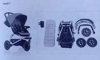 Carrito bebé Mountain Buggy negro y gris.