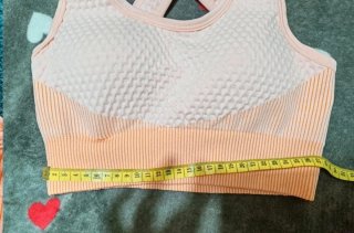 Top deportivo cruzado naranja y rosa