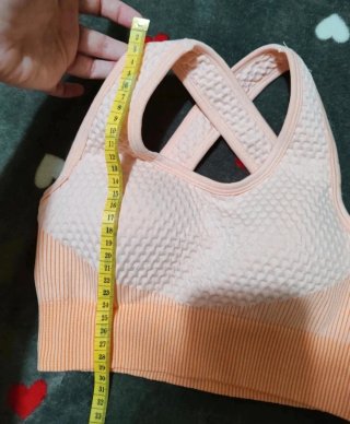 Top deportivo cruzado naranja y rosa