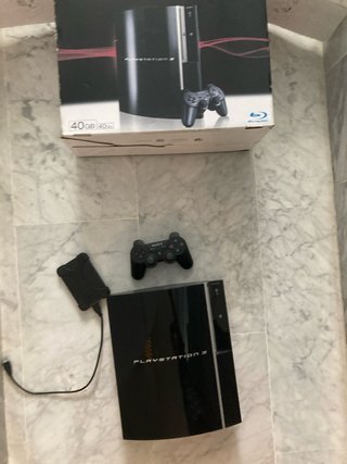 Consola PS3 40GB con mando y caja y un disco duro
