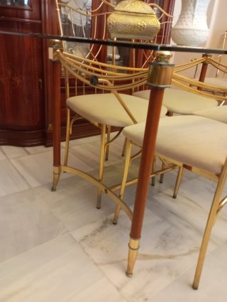 Mesa comedor cristal y 6 sillas doradas