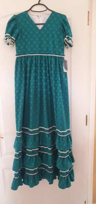 Traje de flamenca verde con flecos