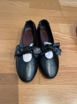 Zapatos planos negros con lazo