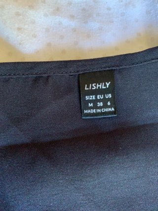 Blusa negra escote uve con encaje talla M