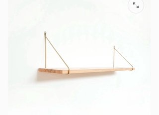 Soportes metálicos dorados para estantería