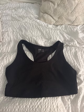 Top deportivo negro WOMEN'S GEAR