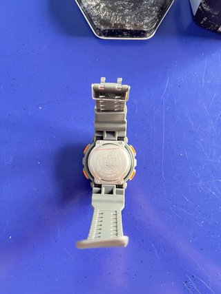 Reloj Shock color verde y naranja nuevo