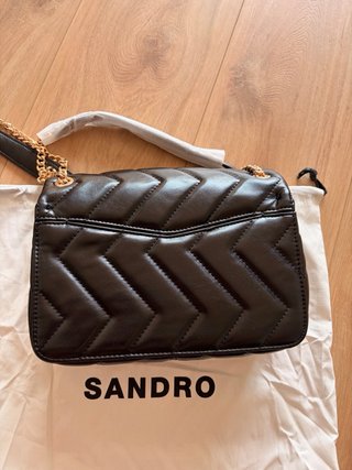 Bolso Sandro negro y dorado