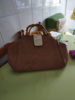 Bolso de mano marrón se vende bolso o para viaje o