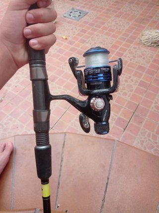 Carrete de pesca spinning Grauvell pago en mano