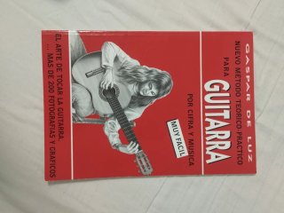 Guitarra, funda, soporte, pua y libro TODO NUEVO