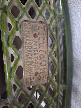 Estufa antigua verde metal y cristal