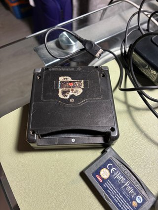 GameBoy Advance SP Negra + Cargador + Harry Potter