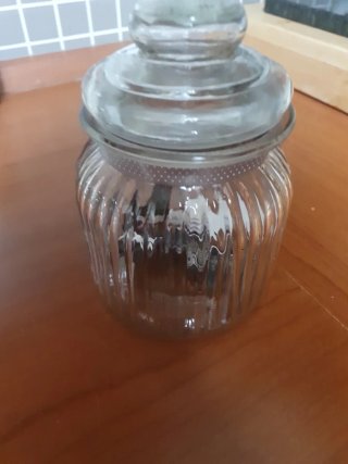 Tarro de cristal con corazón plateado