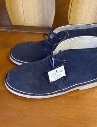 Botines azul marino con cordones de piel