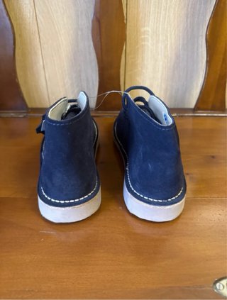 Botines azul marino con cordones de piel