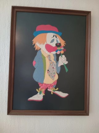 Cuadro de tela de payaso con flor