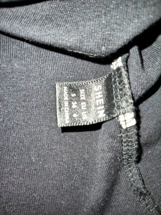 Vestido negro con detalles de malla Talla S