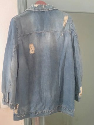 Chaqueta tejana larga desgastada