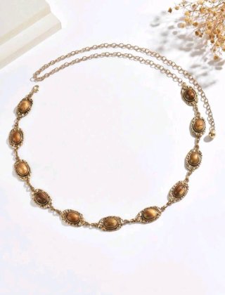 Elegante cadena de cintura dorada con piedras