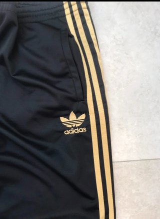 Pantalón Adidas Firebird Negro y Dorado